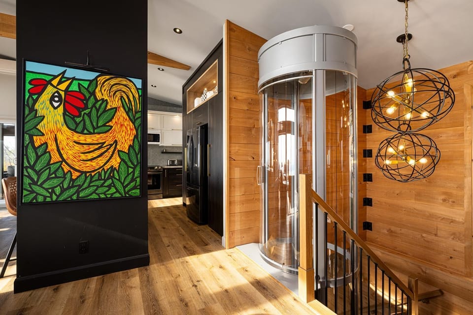 Step into something beautiful, this elevator is as bold as the view.