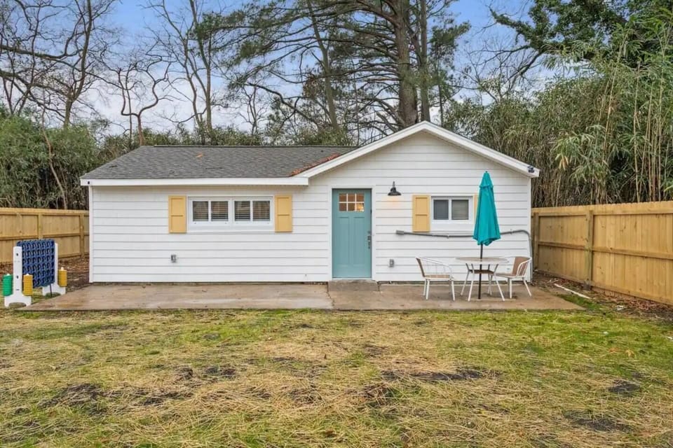 This vibrant shared yard is the perfect spot for outdoor fun and socializing.  Cozy up by the crackling fire pit under the stars  or challenge your neighbors to a giant game of Connect 4. Feeling competitive? Test your skills with a friendly game of cornhole.  Prefer a quieter moment? Relax and enjoy a conversation at the cozy table for two.  This community space is ideal for c...