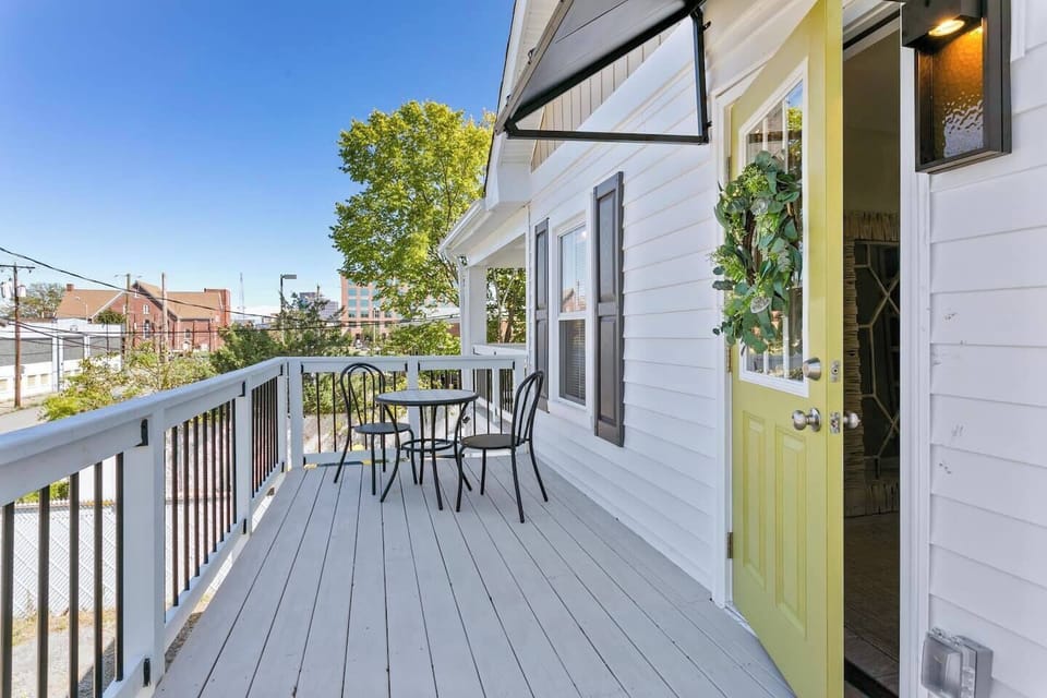 This cozy 2nd-floor patio boasts a table and chairs, perfect for enjoying a cup of coffee and conversation with a friend. Unwind and take in the stunning skyline views from your own private oasis.