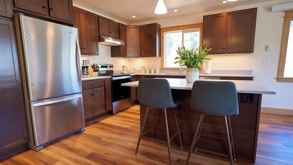 Spacious and well stocked kitchen. Seating for two at the island.