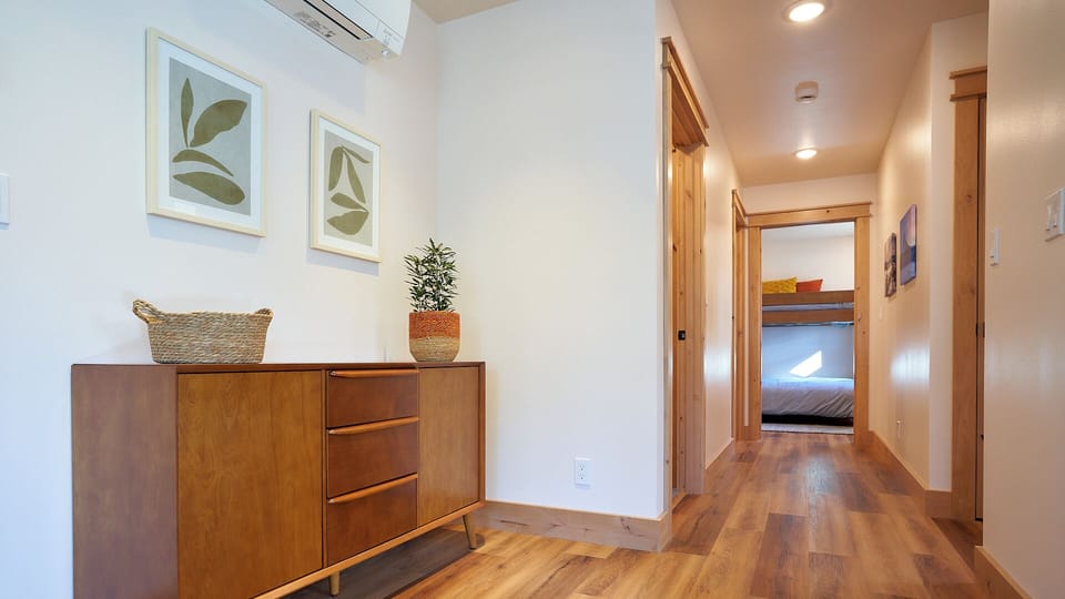 Games are kept in this sideboard and in the ottoman at the couch.
