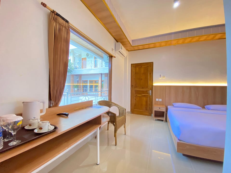 Exclusive Room | Premium bedding, desk, laptop workspace, blackout drapes