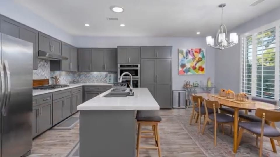 Spacious kitchen dining with seating for 6 at the table and 3 at the counter.