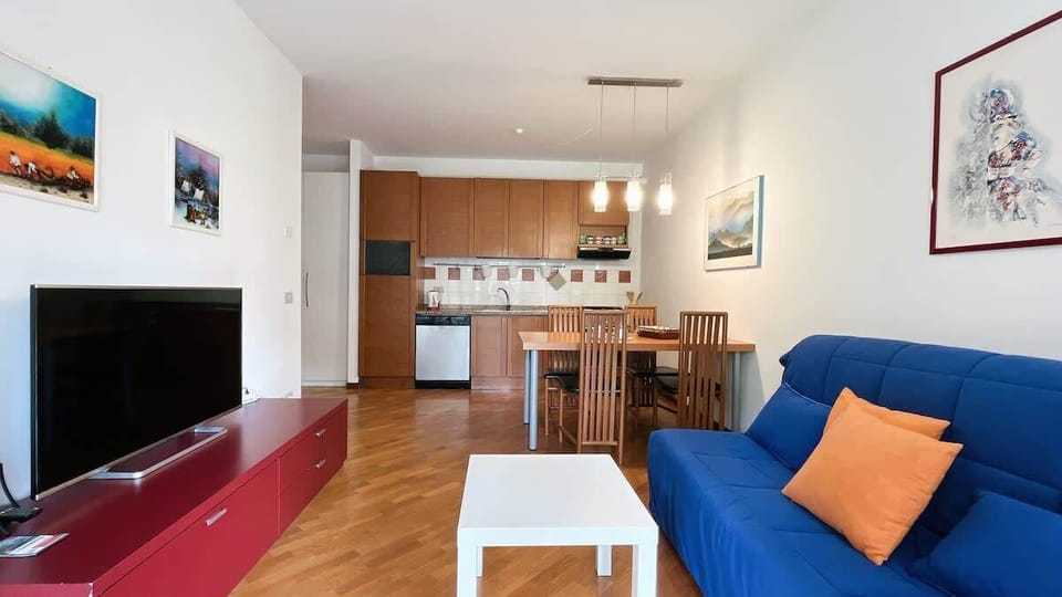 Bright living room with front view of the kitchen