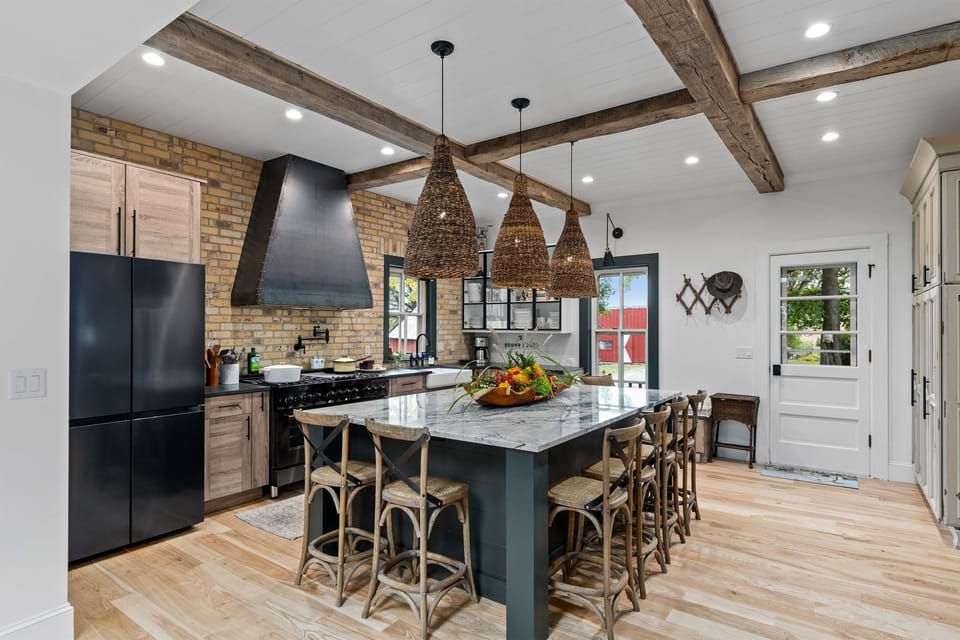 Charming farmhouse kitchen blending rustic touches w/ clean, modern finishes.