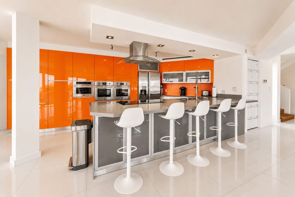 Bold designer kitchen with large island seating for five