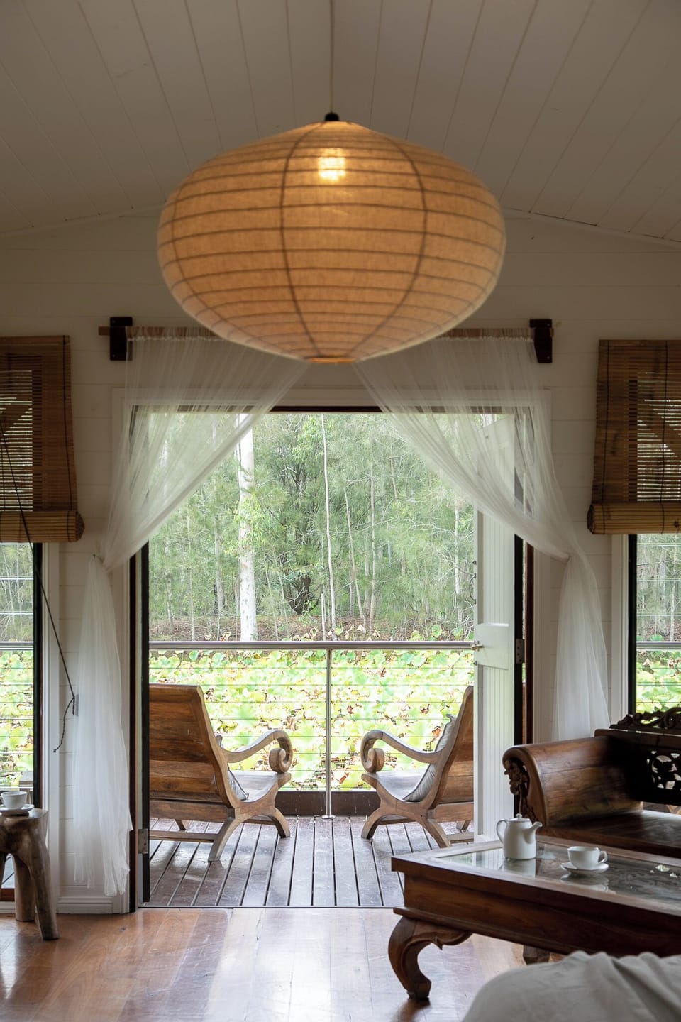 The boathouse is perched on the lotus pond