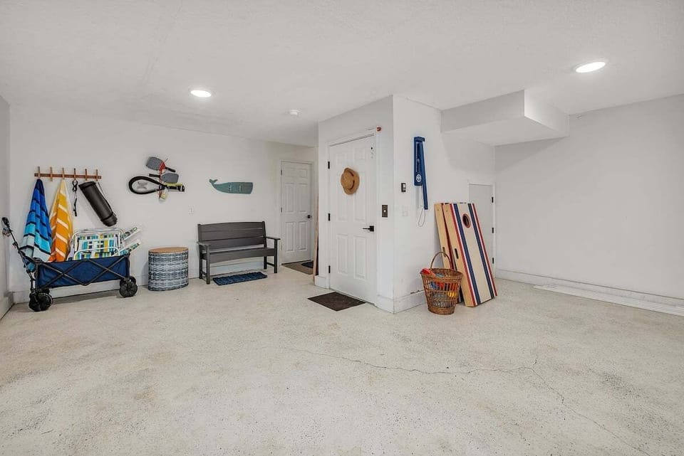 Garage with surfboards, bikes, and beach gear storage