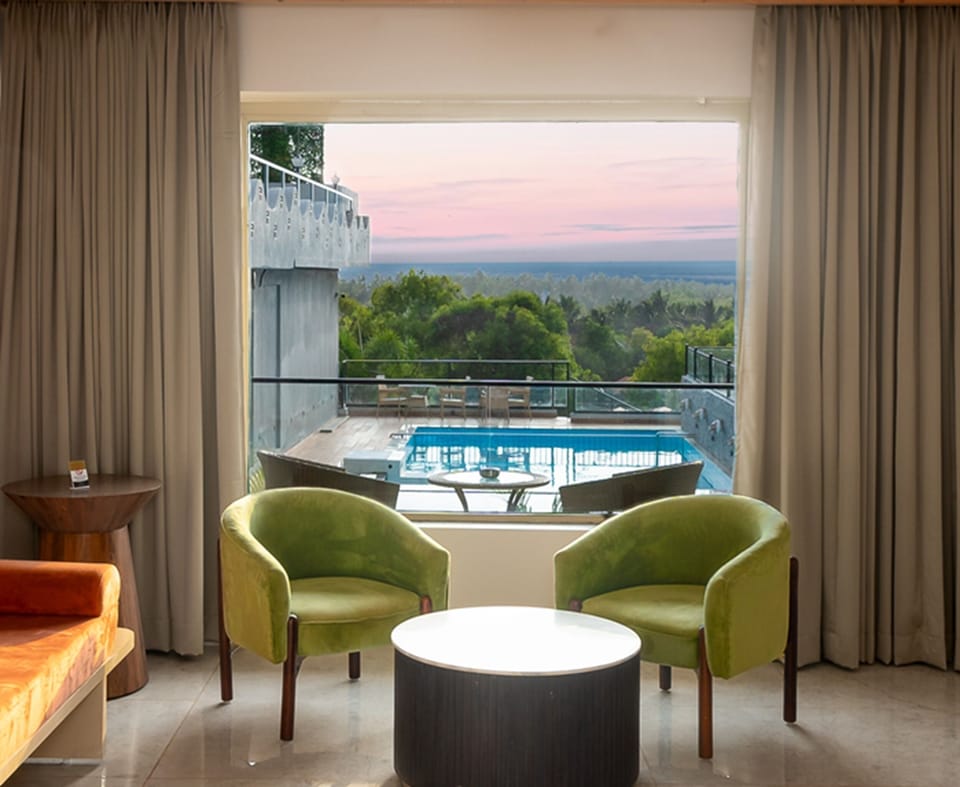 The Grand Superior Pool View Room | Minibar, in-room safe, desk, blackout drapes