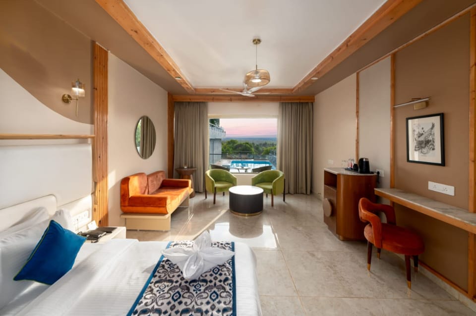 The Grand Superior Pool View Room | Minibar, in-room safe, desk, blackout drapes