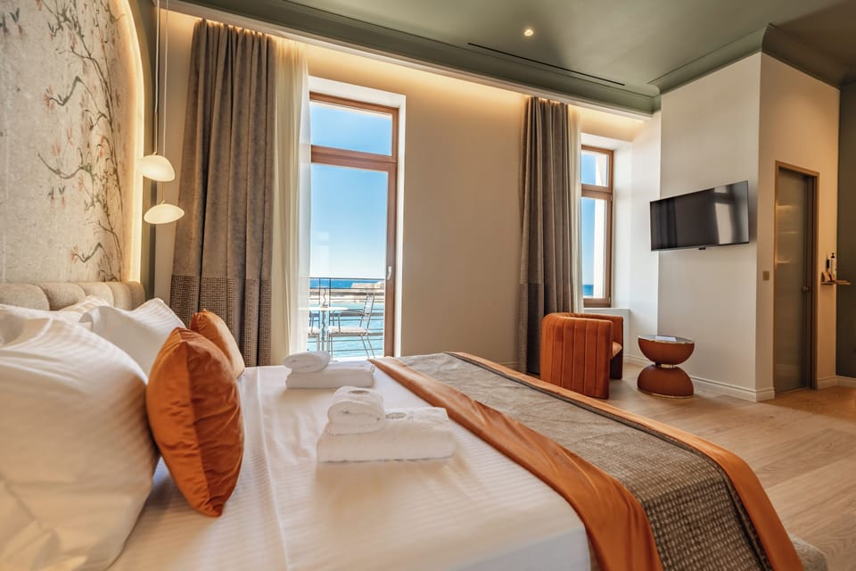 Junior Suite, Balcony, Sea View | Premium bedding, in-room safe, desk, laptop workspace