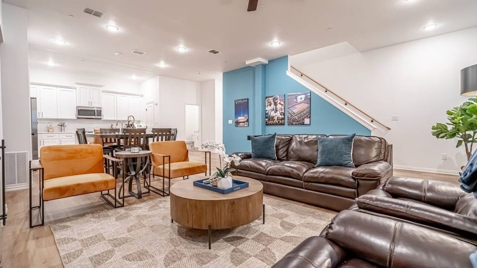 Kick back in a stylish, open-concept living space designed for comfort and connection. Whether you're debriefing after a Rangers game, watching pre-game coverage on the smart TV or just relaxing with your crew—The Ryan's living area has you covered.
