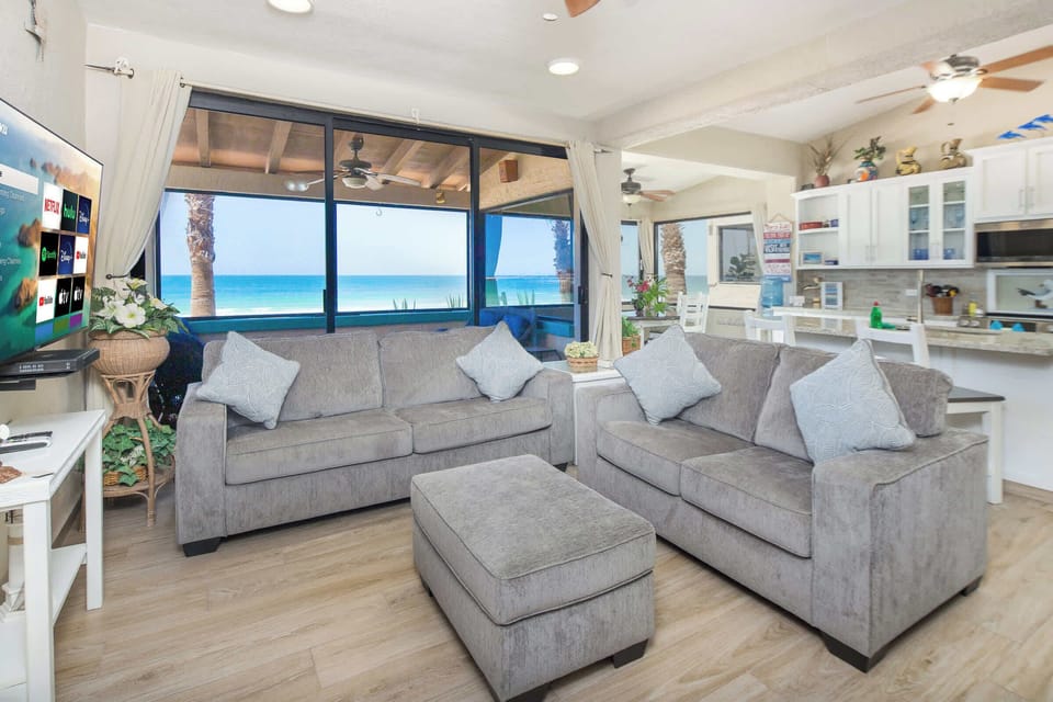 Comfy sleeper sofa for extra guests! 🌴💤 Relax by day and sleep comfortably by night! 🌊🏖️