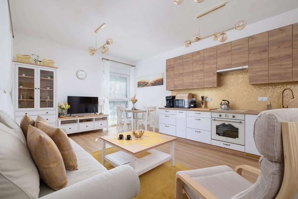 A bright and functional kitchen-living room combo, blending practicality with cozy design.


