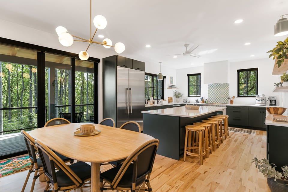 Dining Area & Chef's Kitchen w/ Breakfast Bar Seating