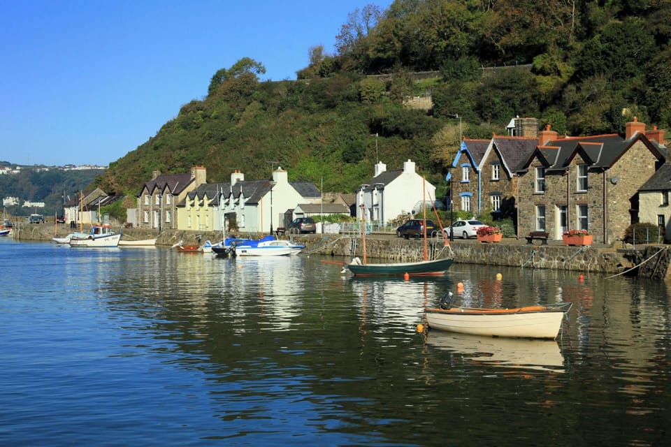 The harbour at Lower Fishguard, cottages on the quay and moored boats