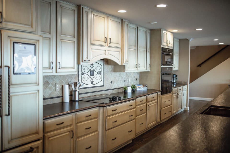 Fully stocked huge kitchen open to living and dining with lake views from every angle!