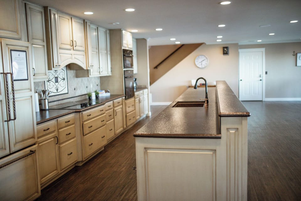 Fully stocked huge kitchen open to living and dining with lake views from every angle!