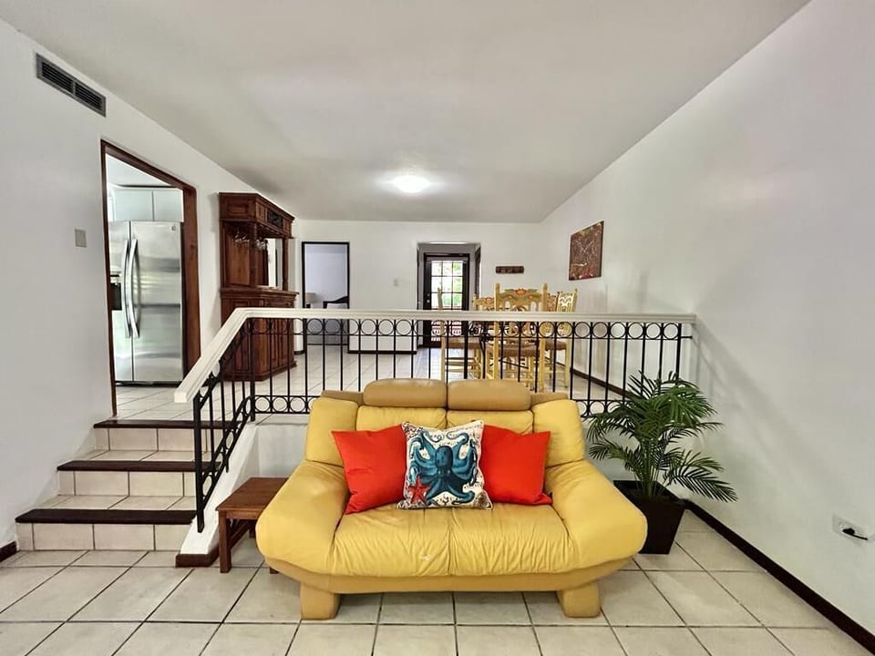 The vibrant colors of our living room are designed to evoke the refreshing and serene atmosphere of a beach.