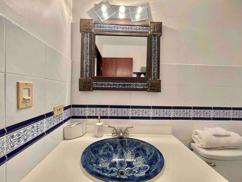 The bathroom exudes a serene and tranquil atmosphere, creating a perfect sanctuary for relaxation and self-care.