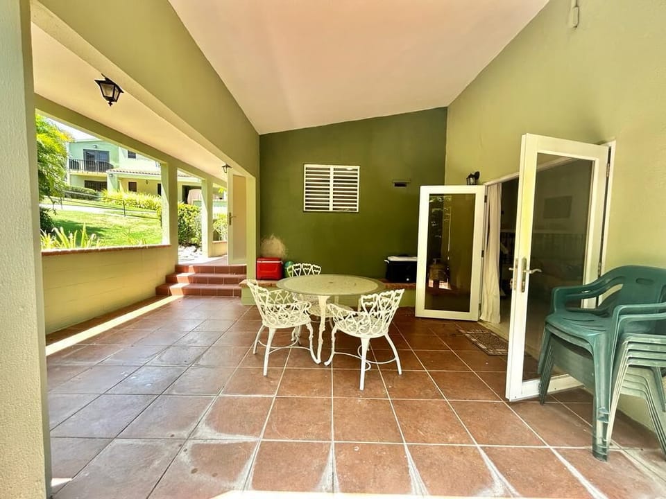 Surrounded by vibrant plants and flowers, the patio becomes a serene oasis, ideal for gathering in the warm sunshine or under the stars.