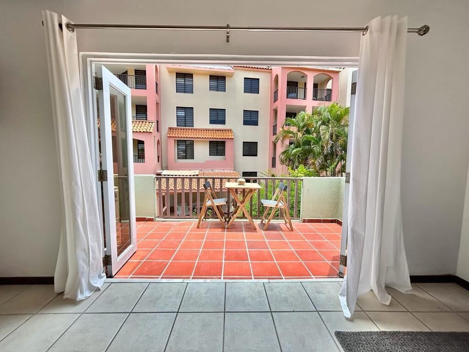 The balcony is perfect for enjoying a pleasant conversation or a cup of coffee.