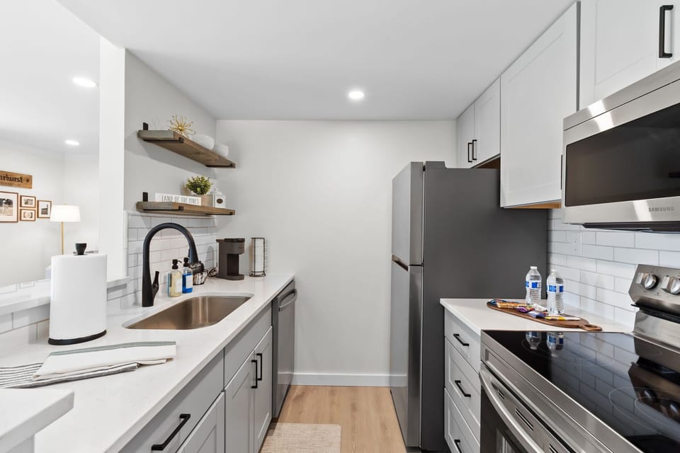 Bright galley kitchen with everything needed for short stays or longer visits.