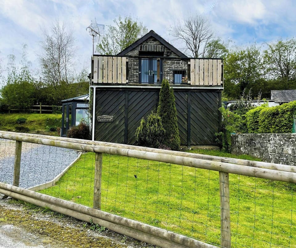 exterior image of property showing enclosed fence