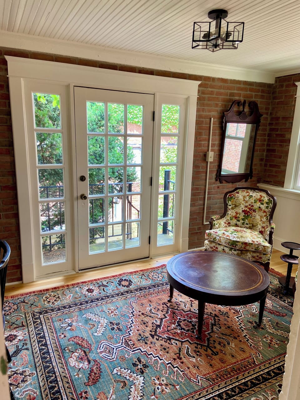 Antique door leading to balcony with spiral staircase to courtyard 