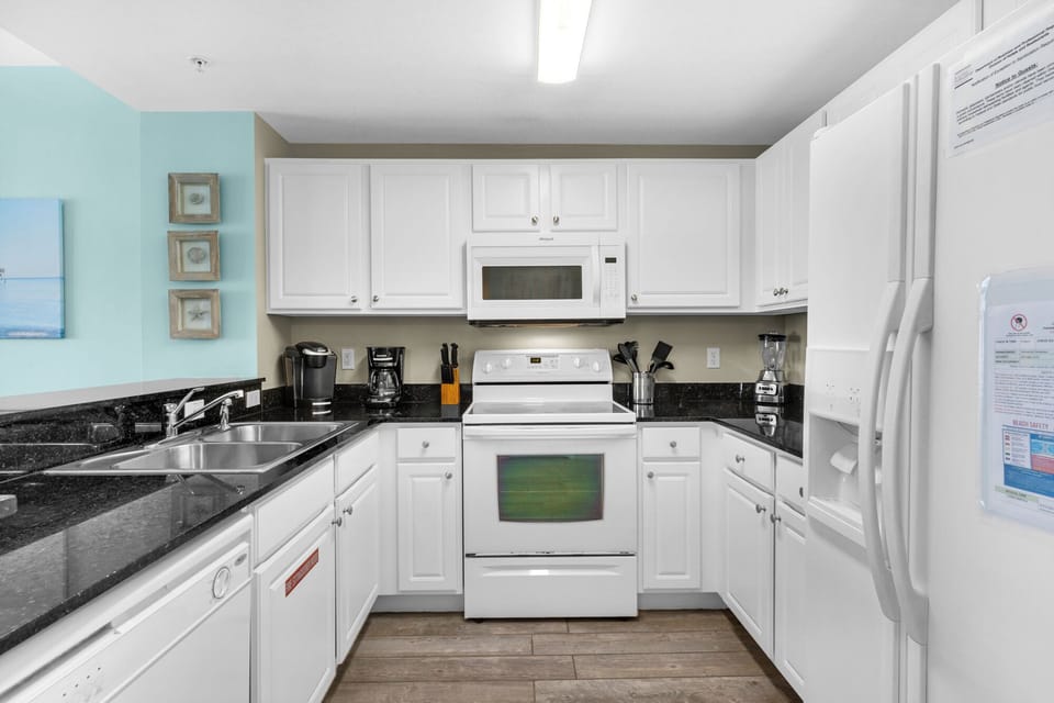 Kitchen - Prepare feasts with ease in this kitchen, outfitted with top-notch appliances and a full suite of cooking essentials.