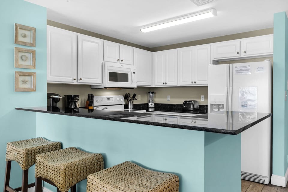 Kitchen - Prepare feasts with ease in this kitchen, outfitted with top-notch appliances and a full suite of cooking essentials.
