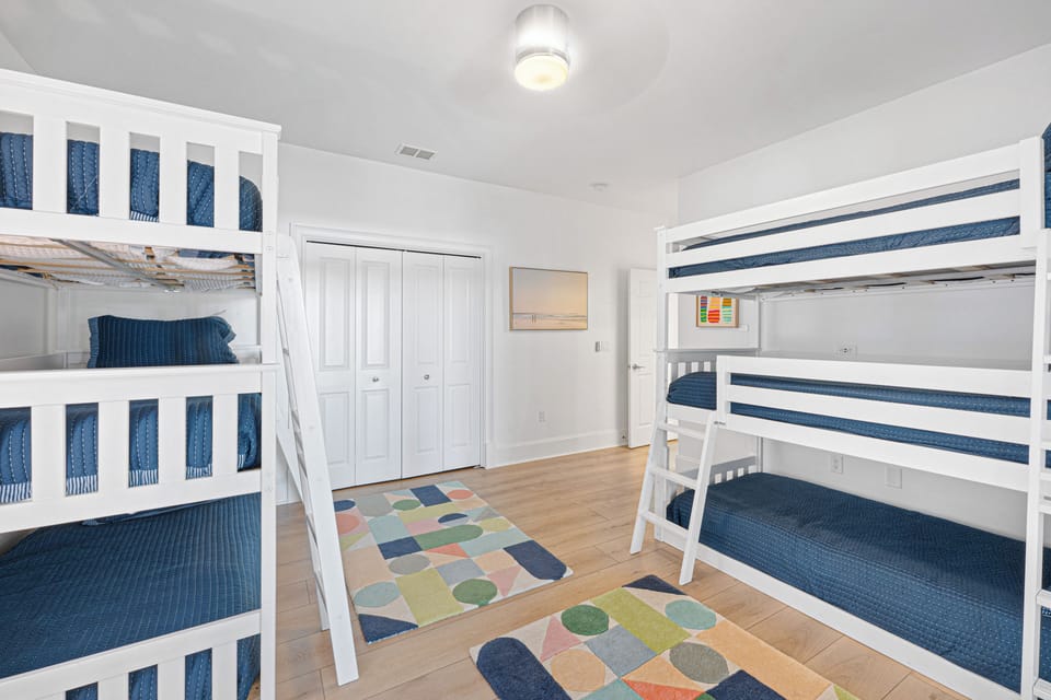 Bunk Bedroom 3, First Floor: Six Twins set up as two triple bunks, Smart TV, Ceiling fan for added ambiance
