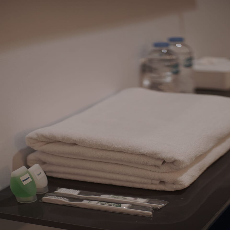 Shower, rainfall showerhead, towels, soap
