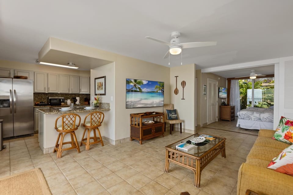 Enjoy an open-concept living space with a fully equipped kitchen and seamless indoor-outdoor flow. Perfect for entertaining while taking in the ocean breeze.