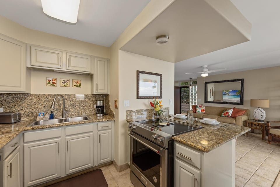 Enjoy stunning ocean views while preparing meals in this bright, airy kitchen. The perfect setting for a beachfront culinary experience.