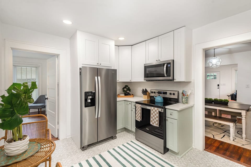 Convenient kitchen with microwave, fridge, and oven to cook, store, and heat your meals anytime.