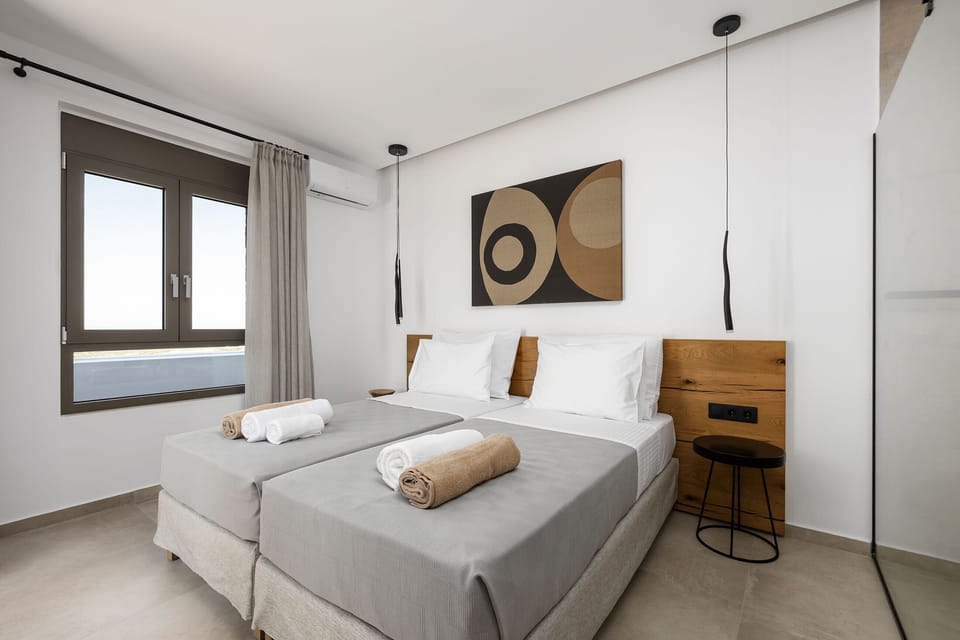 The master bedroom, located on the first floor of the left building