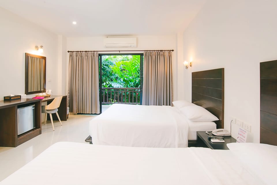 Family Room, Balcony | Blackout drapes, free WiFi, bed sheets