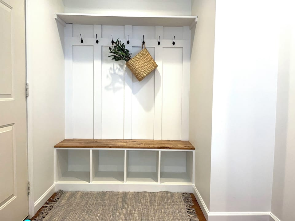 Welcome to our home. Settle in with custom cabinetry and built-in coat racks.