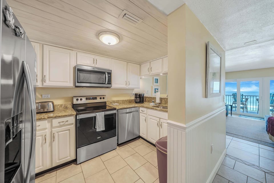 The fully equipped kitchen features granite countertops and stainless-steel appliances and has everything you need to prepare meals for family & friends.