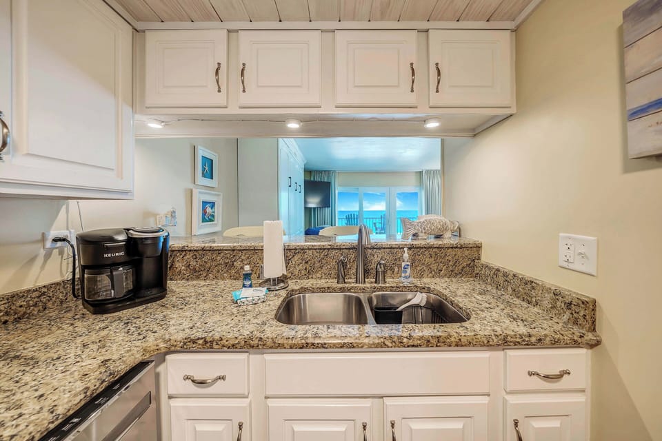 The fully equipped kitchen features granite countertops and stainless-steel appliances and has everything you need to prepare meals for family & friends.
