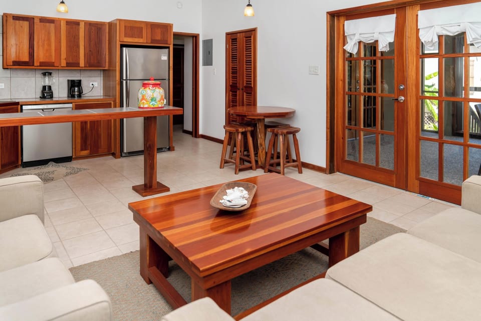 Open floor plan with doors leading to the screened in porch