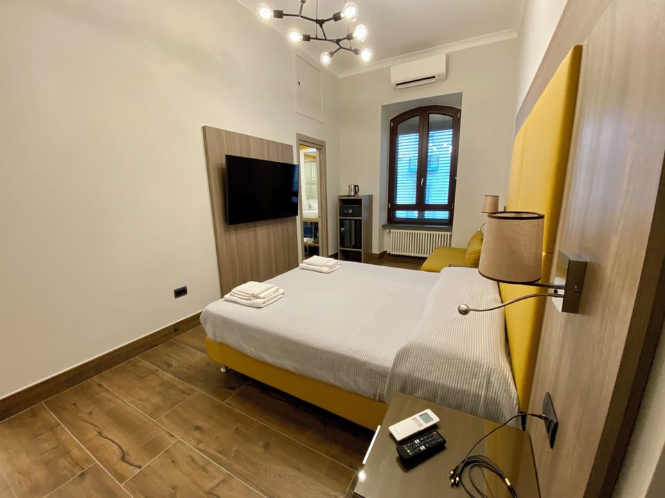 Quadruple Room CARONTE | Premium bedding, down comforters, minibar, in-room safe