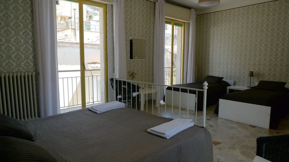 Comfort Quadruple Room, Balcony, City View | Individually decorated, individually furnished