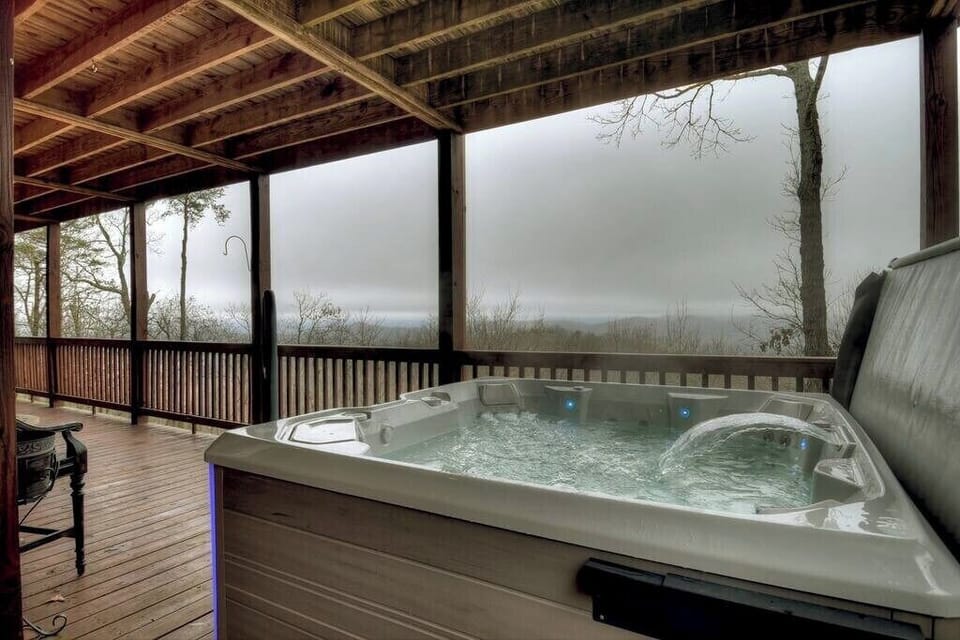 Steaming hot tub overlooking sprawling mountain views