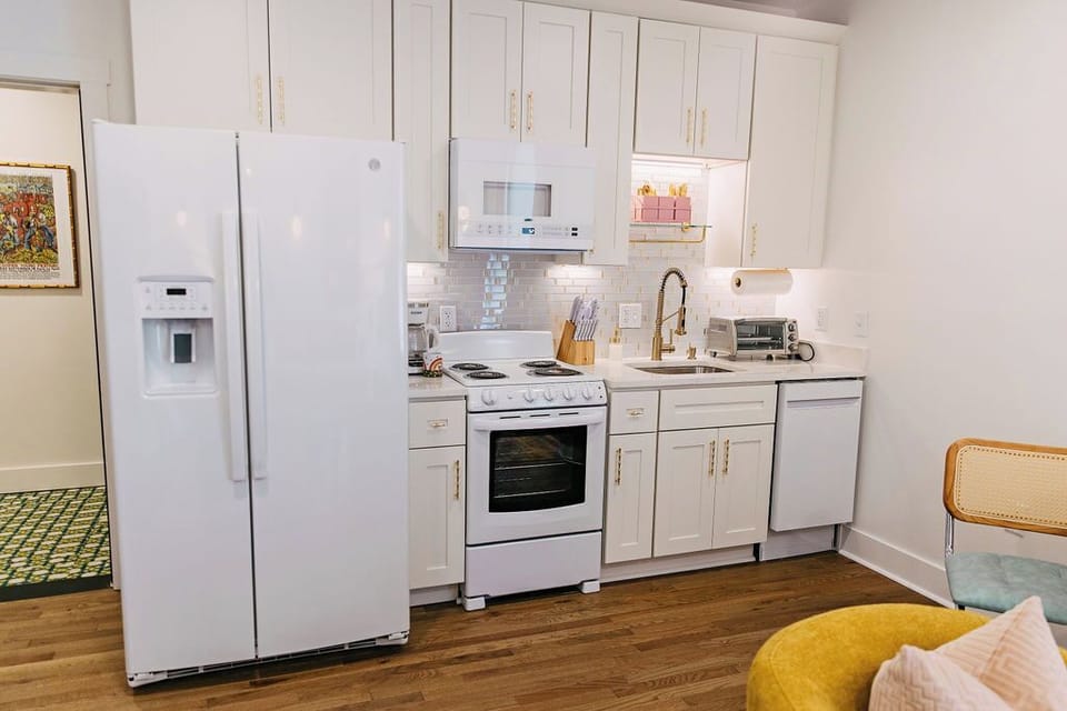 Eat in kitchen with fridge, microwave, oven, range, dishwasher, & toaster oven.