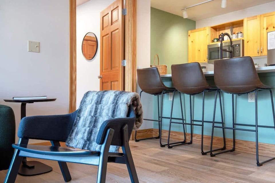 The bar seating is a great spot for eating snacks and socializing. And who doesn't love a good cozy throw blanket? 