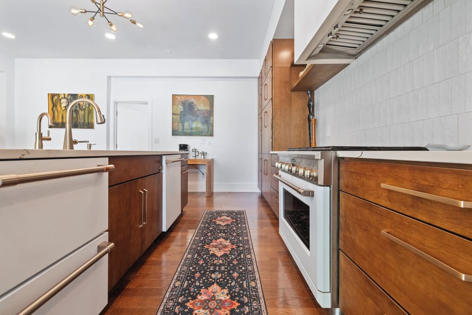 Filtered water tap, beverage fridge, ice maker, dishwasher-every detail covered.