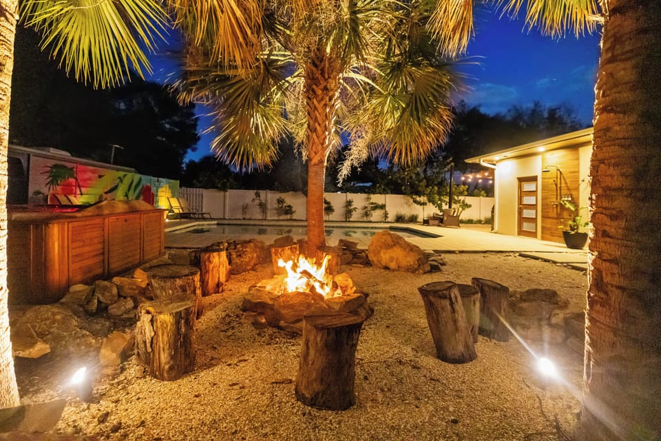 Private, tropical oasis with lush landscaping and serene seating.
