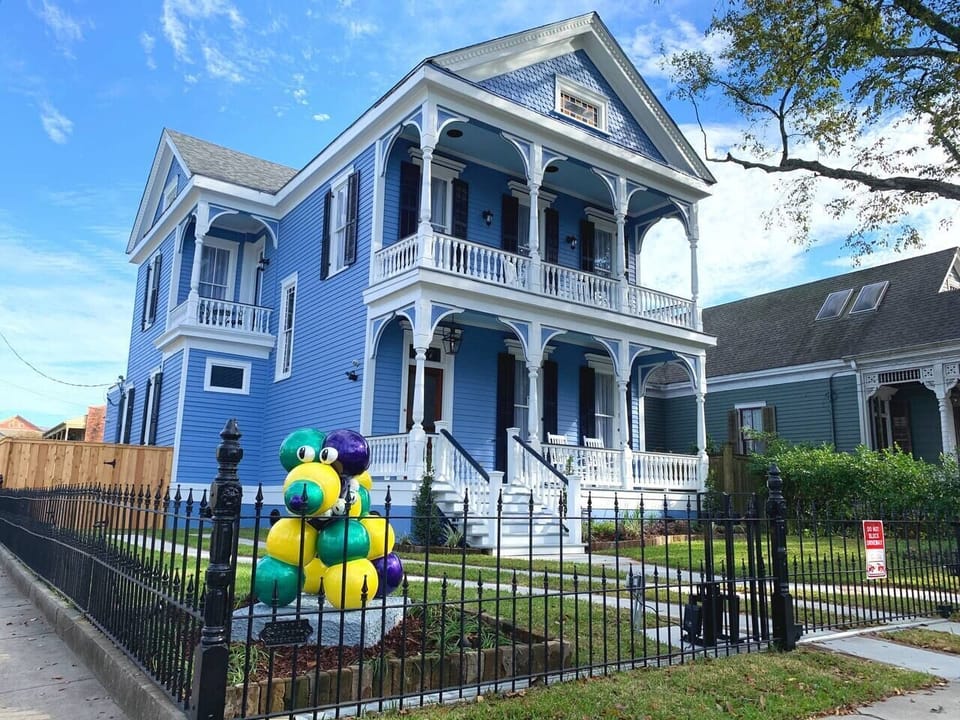 Front View of 5 Bedroom and 3 Bath Uptown Historic Home with Iconic "MARDI GRAS BEAD DOG" Front View with Iconic "MARDI GRAS BEAD DOG"